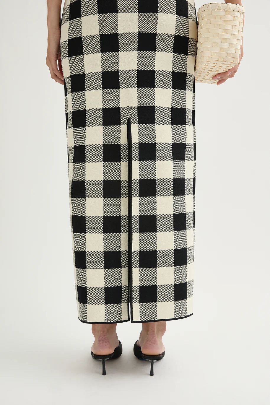 Styled flat lay of the Pippa Skirt in Heritage Plaid alongside coordinating pieces for a trendy outfit inspiration.