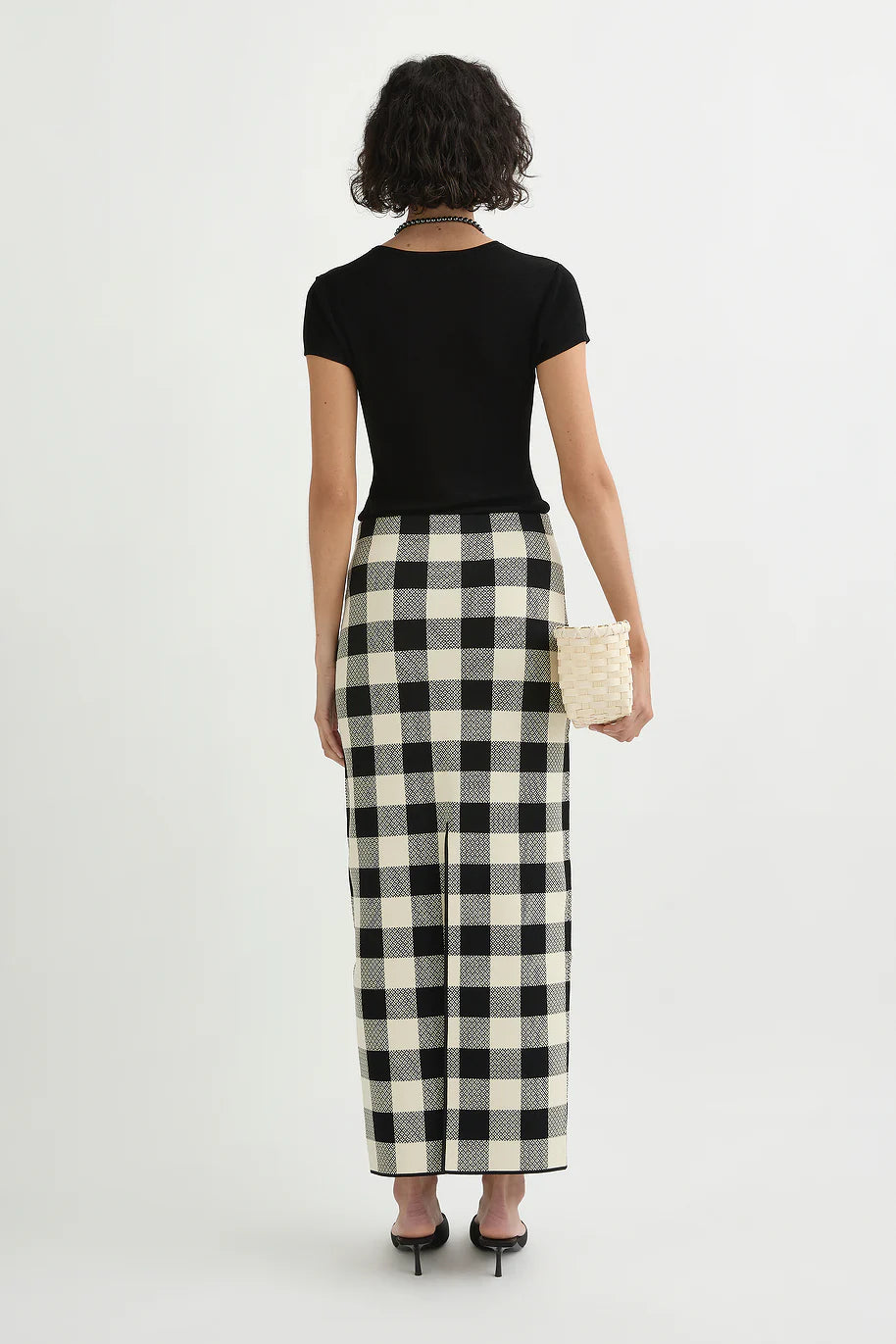 Back view of the Pippa Skirt in Heritage Plaid featuring a back center split for ease of movement.