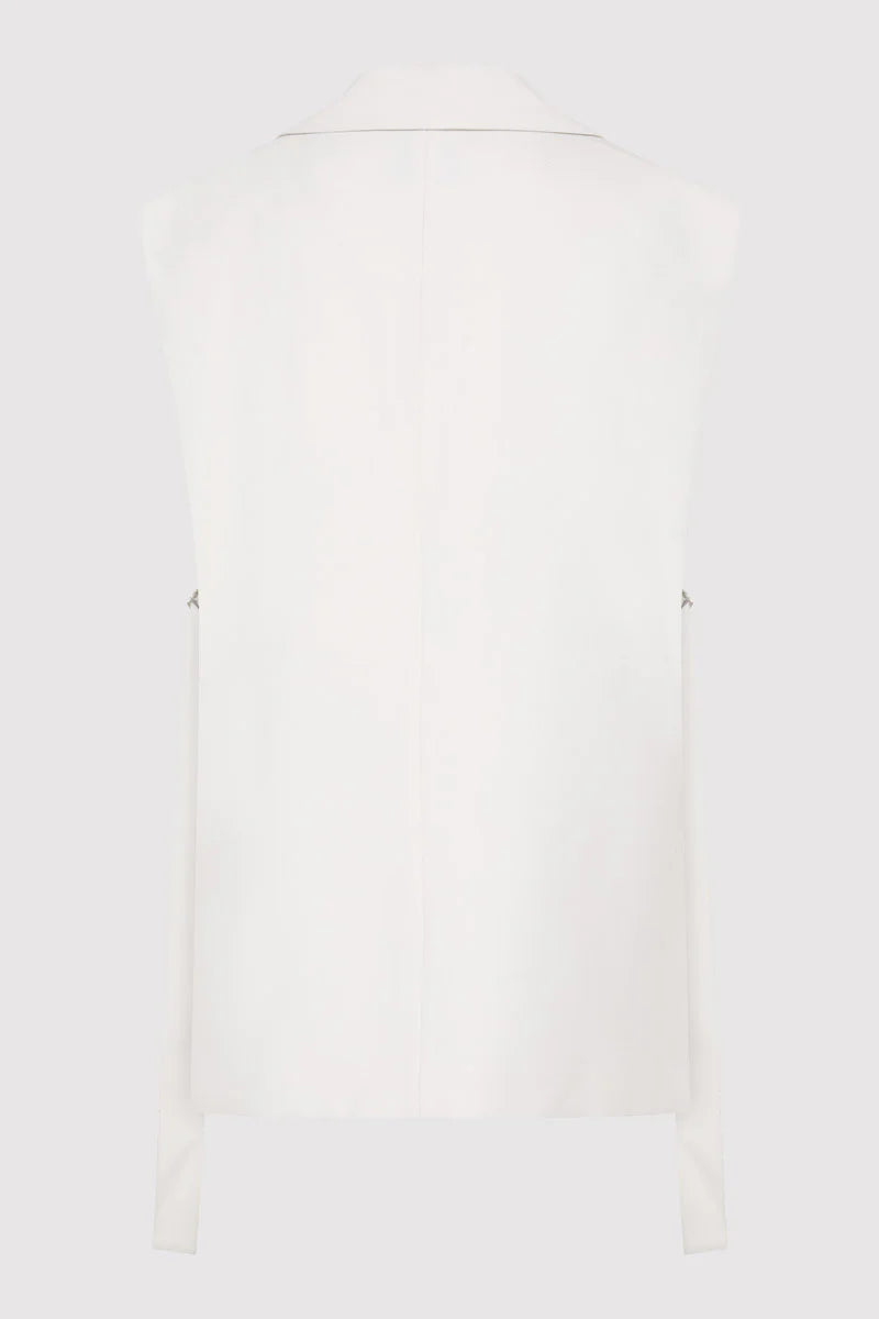 Lifestyle image of the Relaxed Side Tie Vest in Off White, reflecting casual elegance and comfort by St. Agni.