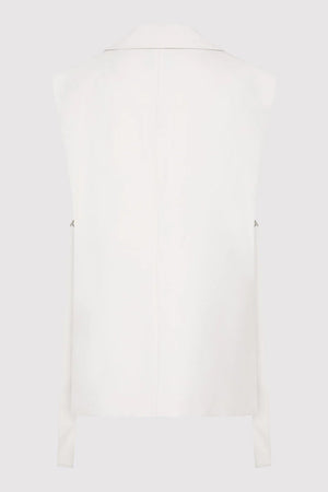 Lifestyle image of the Relaxed Side Tie Vest in Off White, reflecting casual elegance and comfort by St. Agni.