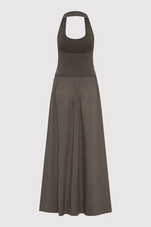 Lifestyle image of the Halter Gathered Dress in Khaki, worn casually to show off its versatility as a halter maxi dress.