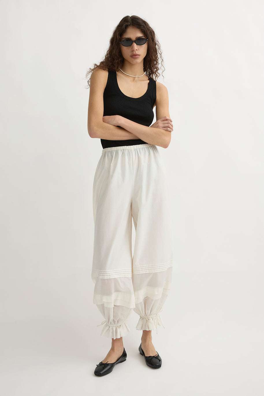 Close-up of the Finley Tank in Black showcasing the knit texture and semi-sheer design.
