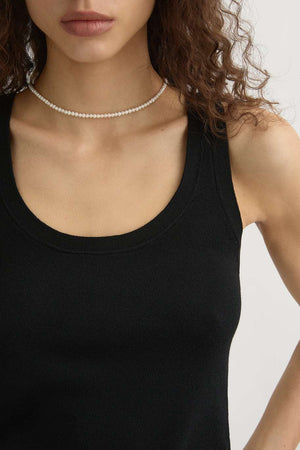Flat lay of the Finley Tank in Black highlighting the lightweight 100% wool fabric.