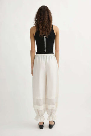 Model wearing the Finley Tank in Black styled for a layered look.