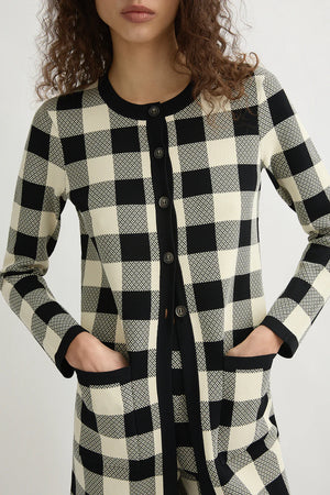 Pippa Cardigan in Heritage Plaid laid flat, emphasizing the unique design and comfort of Posse's knitwear.