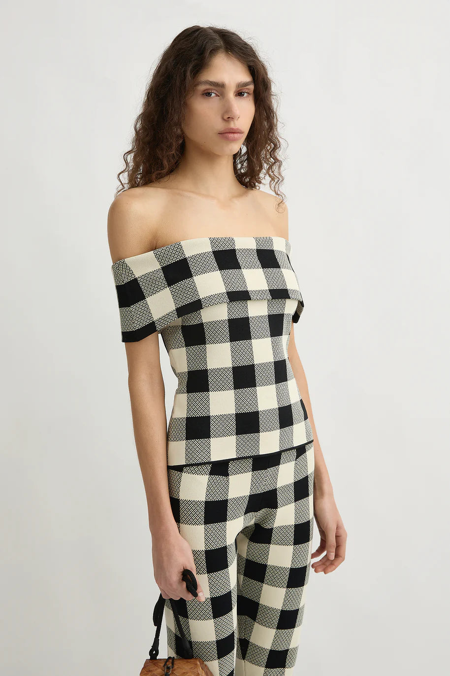 Back view of the Pippa Strapless Top in Heritage Plaid highlighting its stylish design and casual elegance.