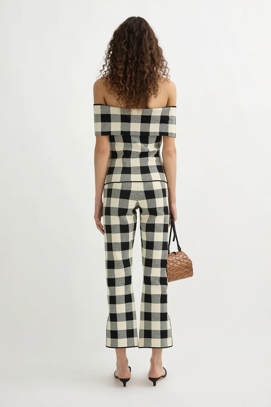 Fashion model wearing the Pippa Strapless Top in Heritage Plaid paired with matching Pippa Pants.