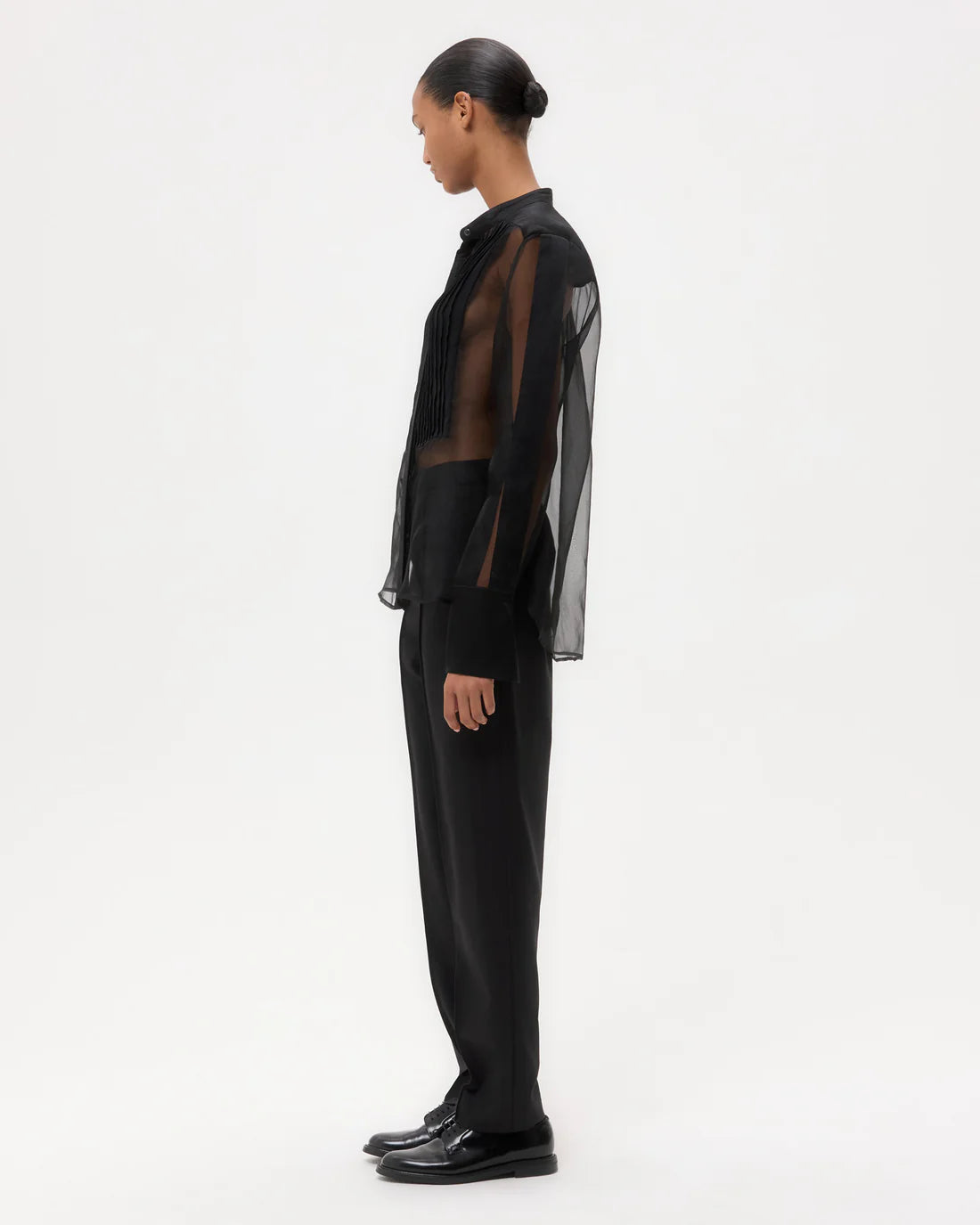 Peyton Top in Black, featuring a deep chest patch pocket and an exposed button-up placket for a chic look.
