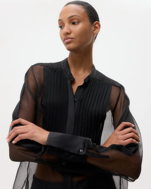 Peyton Top in Black laid flat, emphasizing the luxurious 100% silk fabric and sophisticated design elements.