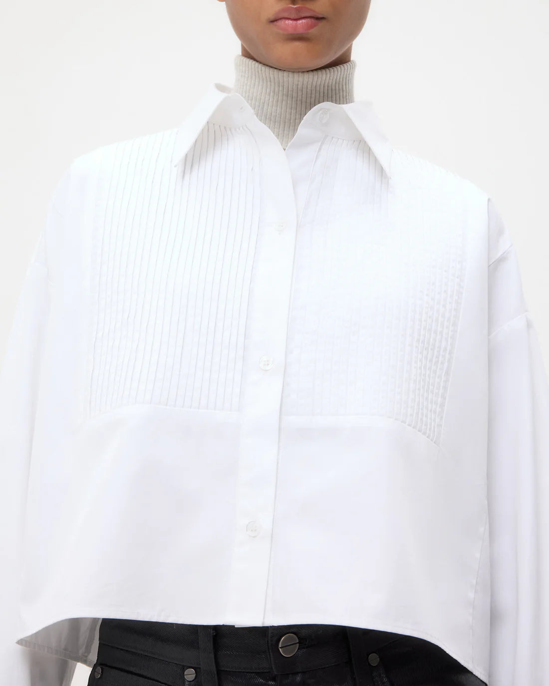 TWP's Soon To Be Ex in white displayed on a hanger, ideal for showcasing its stylish design and cotton composition.