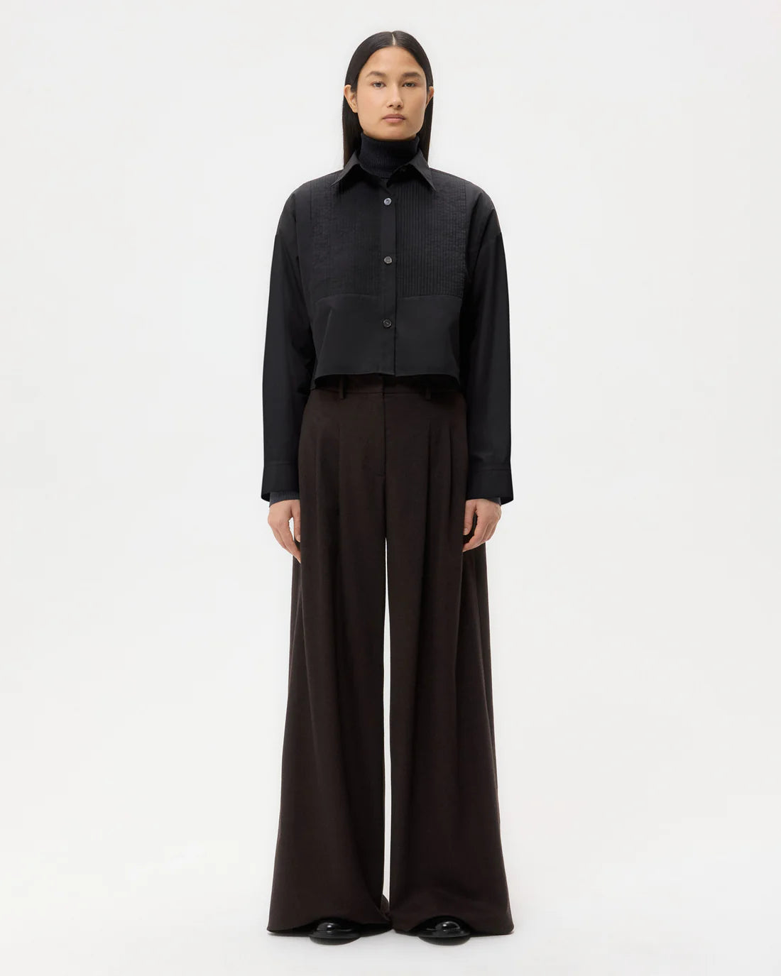 Close-up view of the black Soon To Be Ex shirt from TWP, showing button-up placket and chest pocket.