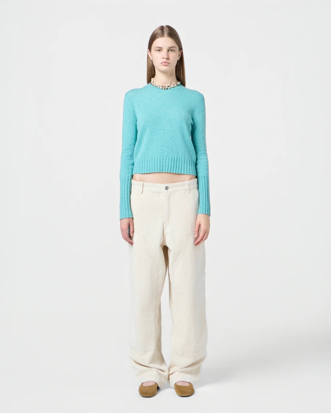 Close-up of the Shrunken Crew in Glacier highlighting the rib trim hem and signature branding.