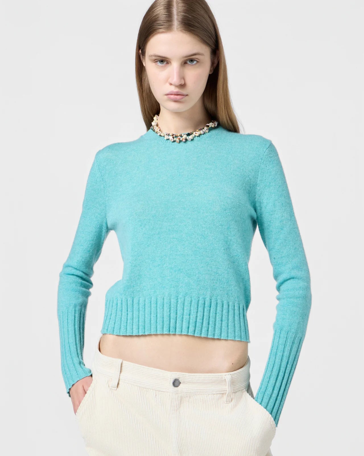 Flat lay of the Shrunken Crew in Glacier, emphasizing the lightness and quality of the 100% cashmere composition.