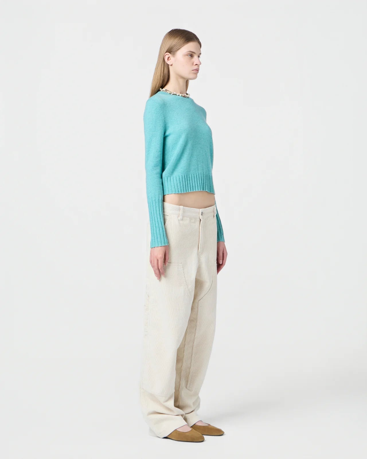 Model wearing the Shrunken Crew in Glacier, demonstrating its slim fit and soft cashmere fabric.