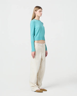 Model wearing the Shrunken Crew in Glacier, demonstrating its slim fit and soft cashmere fabric.
