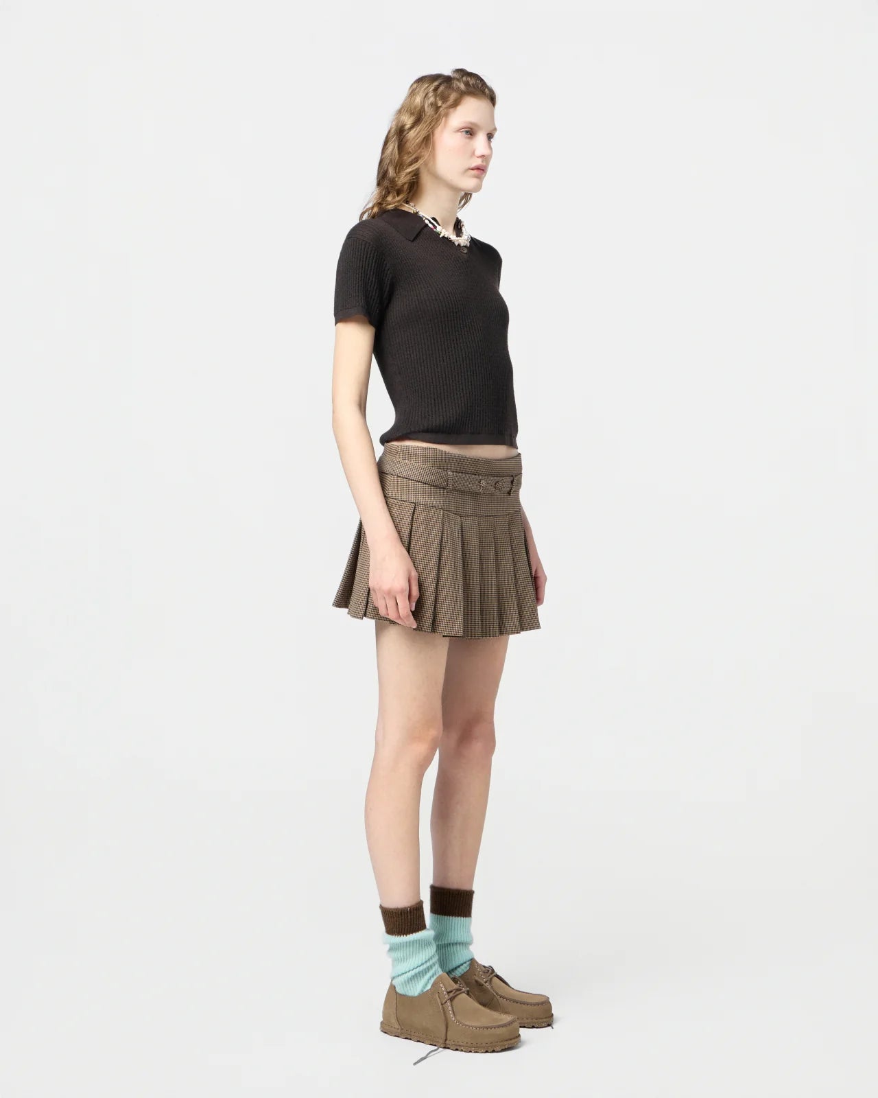 Model wearing the Shrunken Polo in Burnt Cocoa, styled effortlessly for a casual chic look.