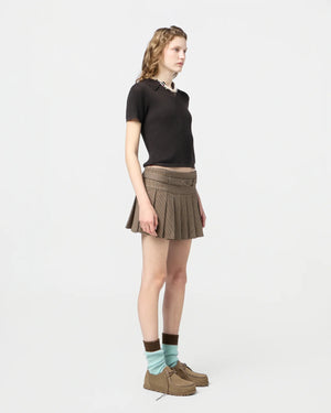 Model wearing the Shrunken Polo in Burnt Cocoa, styled effortlessly for a casual chic look.