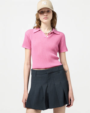Back view of the Shrunken Polo in Rose emphasizing the signature branding at the neck.