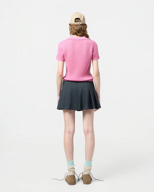 Model wearing the Shrunken Polo in Rose, demonstrating its fit and lightweight feel.