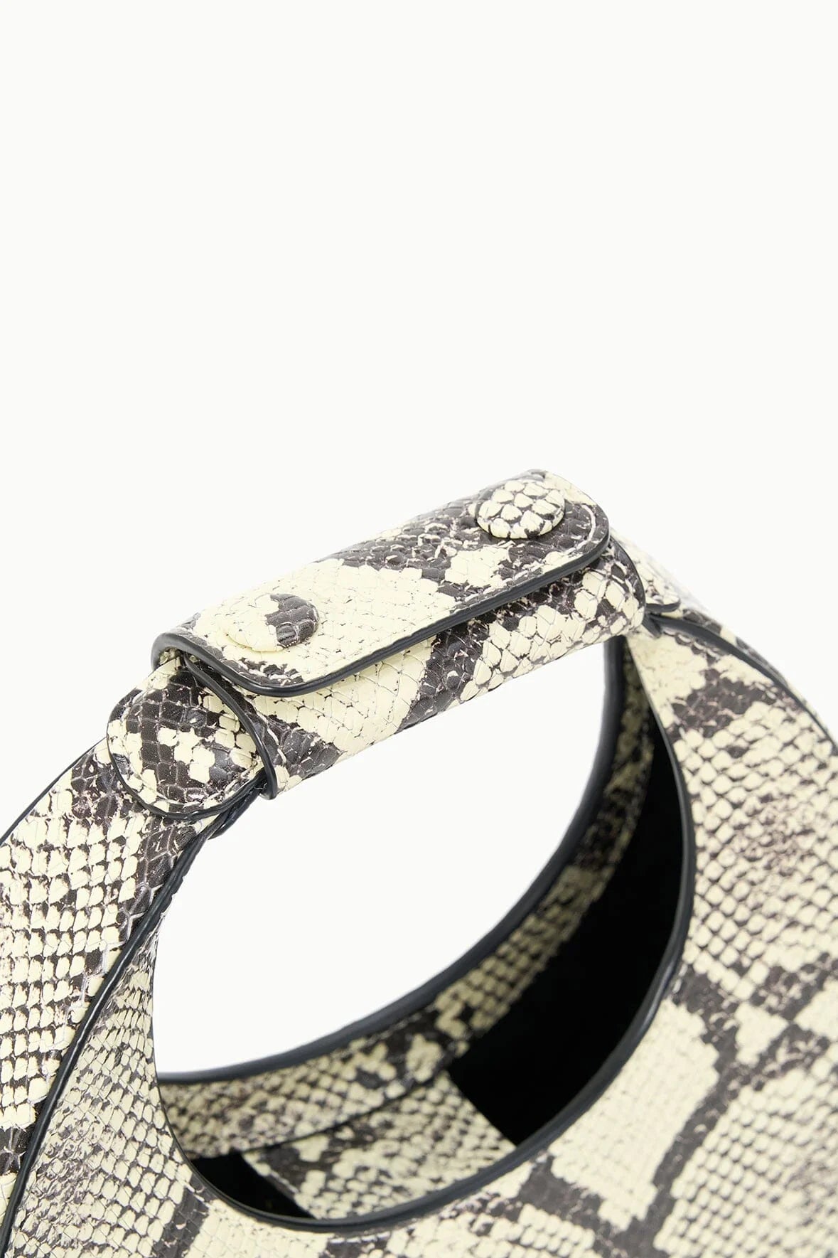 The Goodnight Moon Bag in White Snake by Staud displayed elegantly on a neutral background.