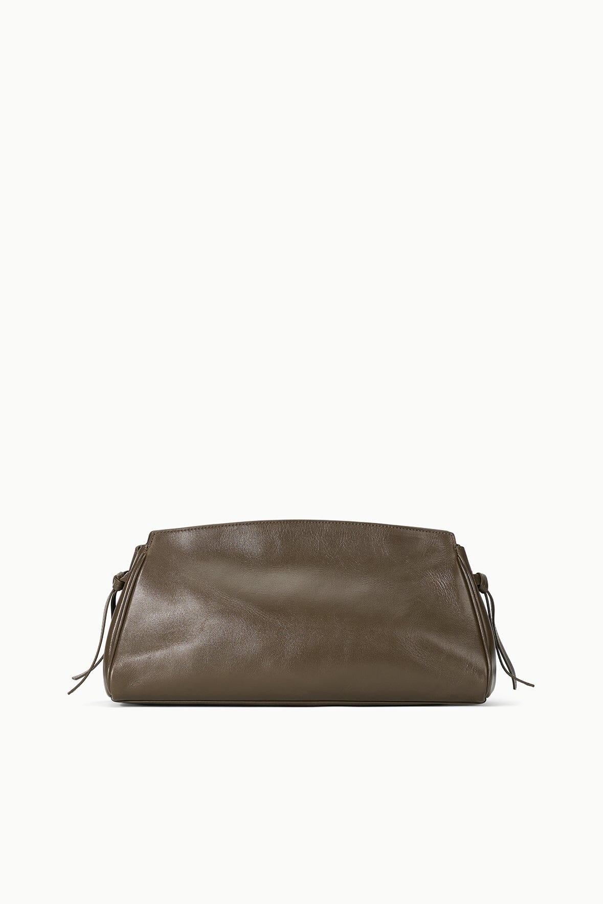 Maude Soft Clutch in Truffle posed on a chic background, emphasizing its modern and sophisticated design.