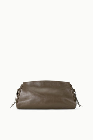 Maude Soft Clutch in Truffle posed on a chic background, emphasizing its modern and sophisticated design.