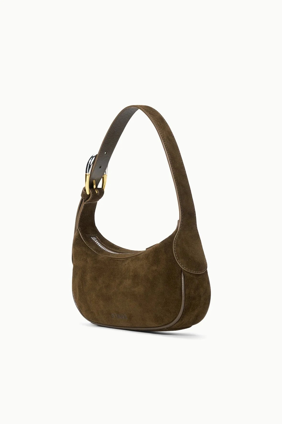 Close-up of the Owen Bag in Truffle suede, showcasing its signature moon-buckle hardware.