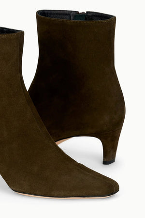 Back view of Wally Ankle Boot in Truffle Suede highlighting the sleek design by Staud.