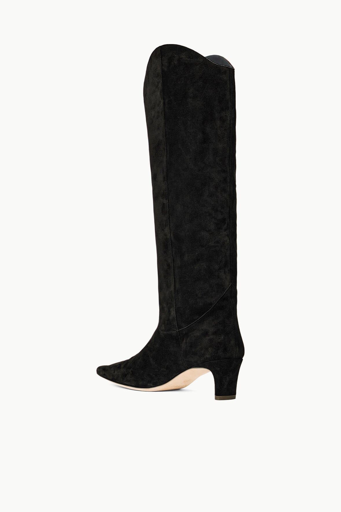 Staud Black Suede Wally Boot displayed on a textured surface for a fashion-focused look.
