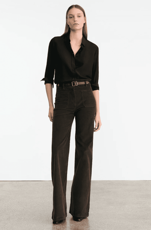 Close-up view of Nili Lotan's Florence Corduroy Pant in Chocolate Brown, highlighting button fly and fabric texture.