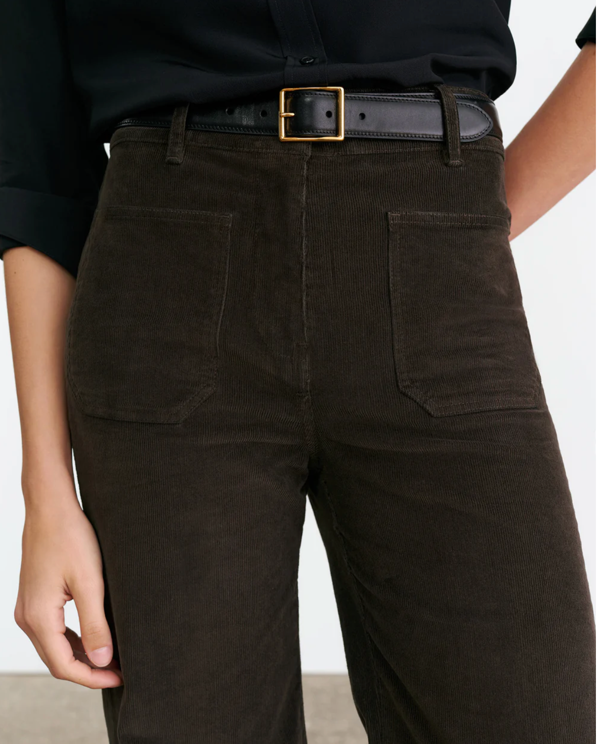 Back view of Nili Lotan's Florence Corduroy Pant in Chocolate Brown, spotlighting the stitching and pocket placement.