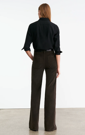 Nili Lotan Florence Corduroy Pant in Chocolate Brown displayed on a hanger, emphasizing the belt loops and pocket details.