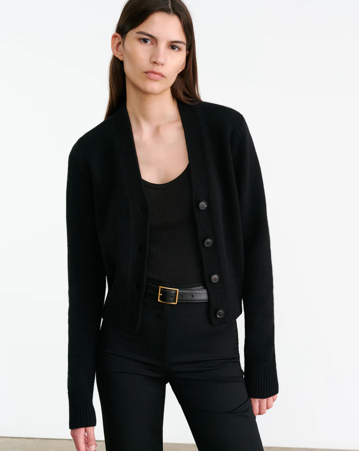 Model wearing the Charmaine Cashmere Cardigan in Black, styled with casual chic outfits to emphasize versatility.