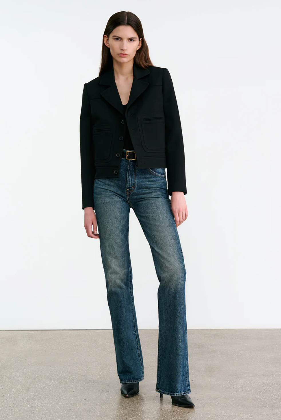 Side view of the Nili Lotan Georgy Jacket in Black highlighting full-length sleeves and back yoke details.