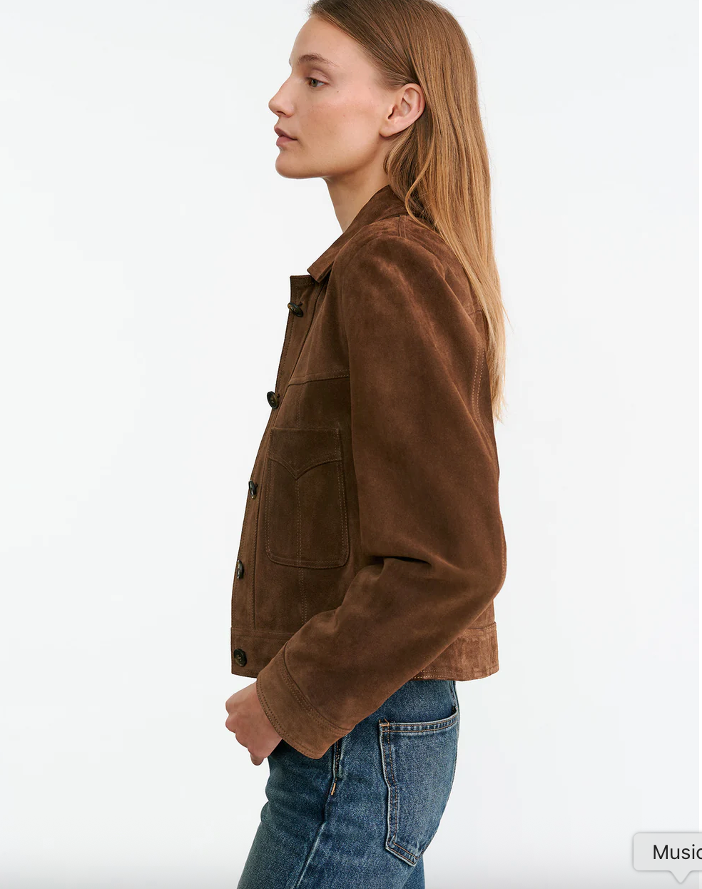 Close-up of the logo buttons on the Susannah Suede Jacket in Hazelnut, demonstrating the quality craftsmanship of Nili Lotan.