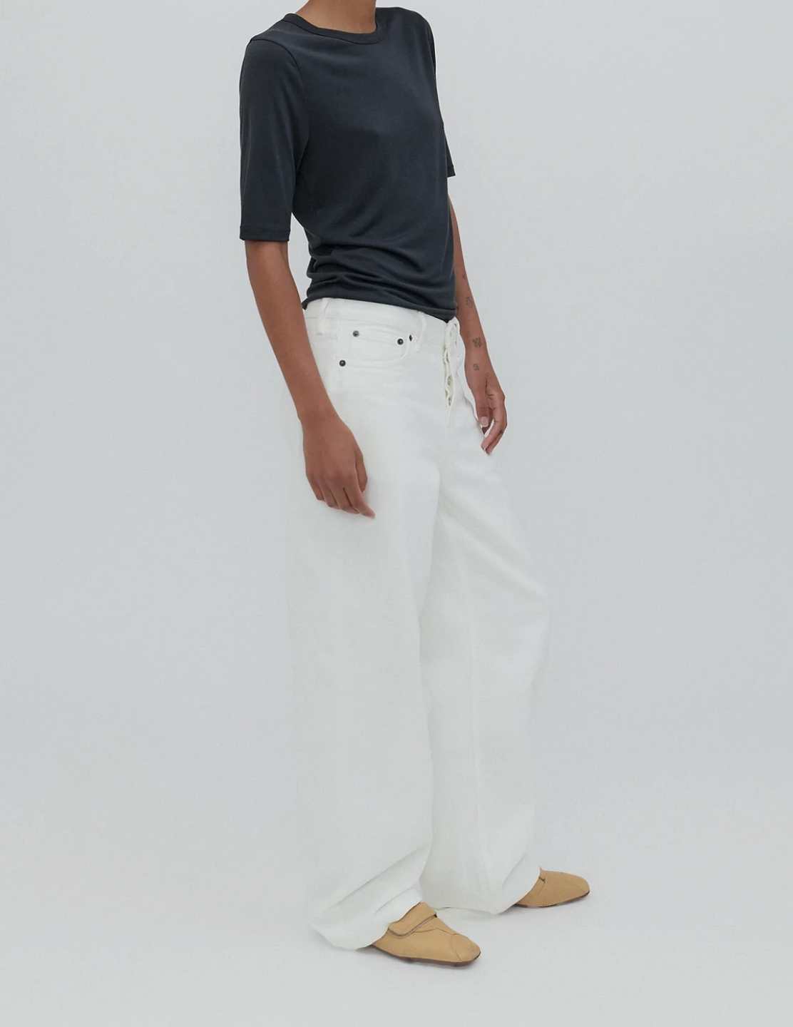 Close-up of the Everyday Jean in Milk featuring signature 'SH' embroidery and custom hardware highlights.