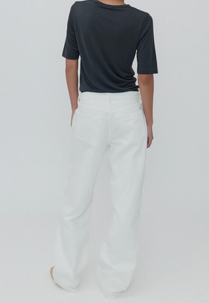 Everyday Jean in Milk displayed on a model, highlighting its versatility for casual day-to-night wear.