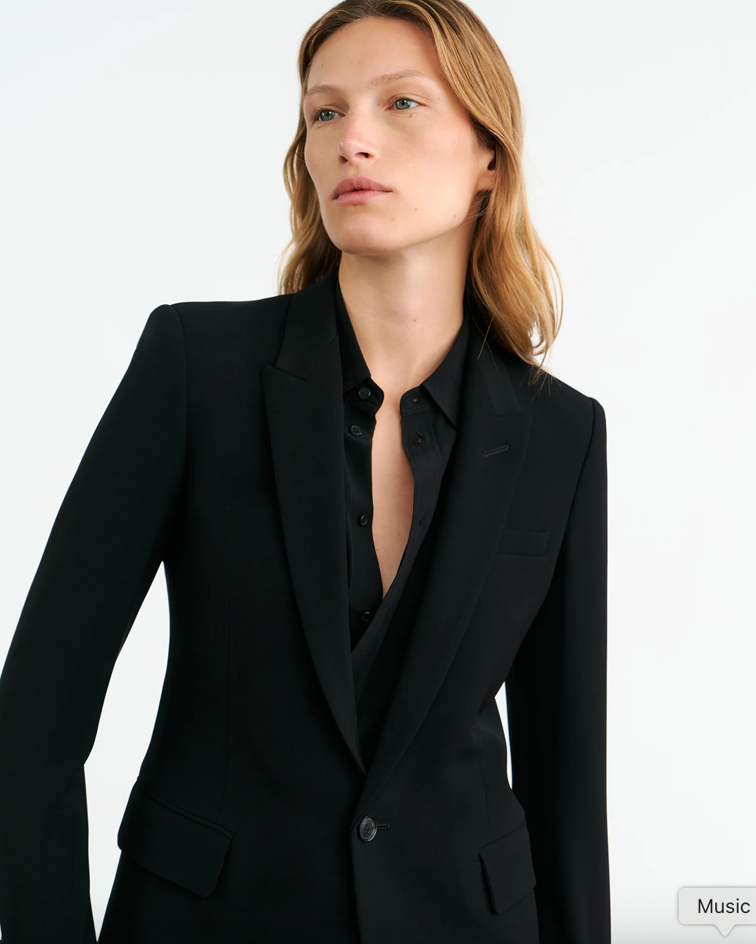 Back view of the Anabel Tailored Jacket in Black emphasizing the center back vent and fully lined interior.