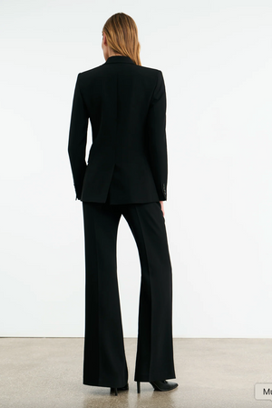 Side view of the Anabel Tailored Jacket in Black featuring full length sleeves and chest piece detailing.