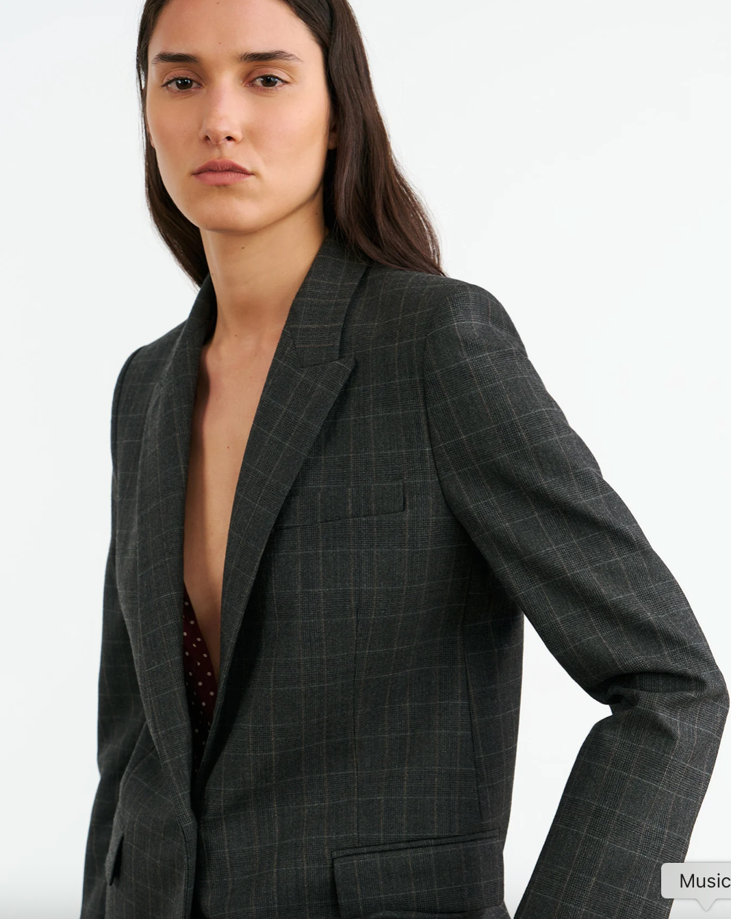 Nili Lotan's Diane Blazer in Espresso Check styled with a casual outfit, suitable for both work and outings.