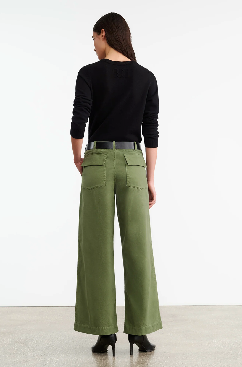 Leon Boy Pant in Camo showcased on a model, highlighting its relaxed fit and camo pattern.