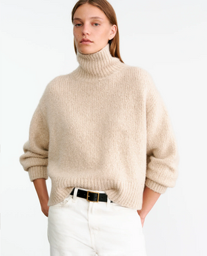 Full view of the Tabitha Sweater in Beige Melange emphasizing its boxy fit and elegant silhouette.