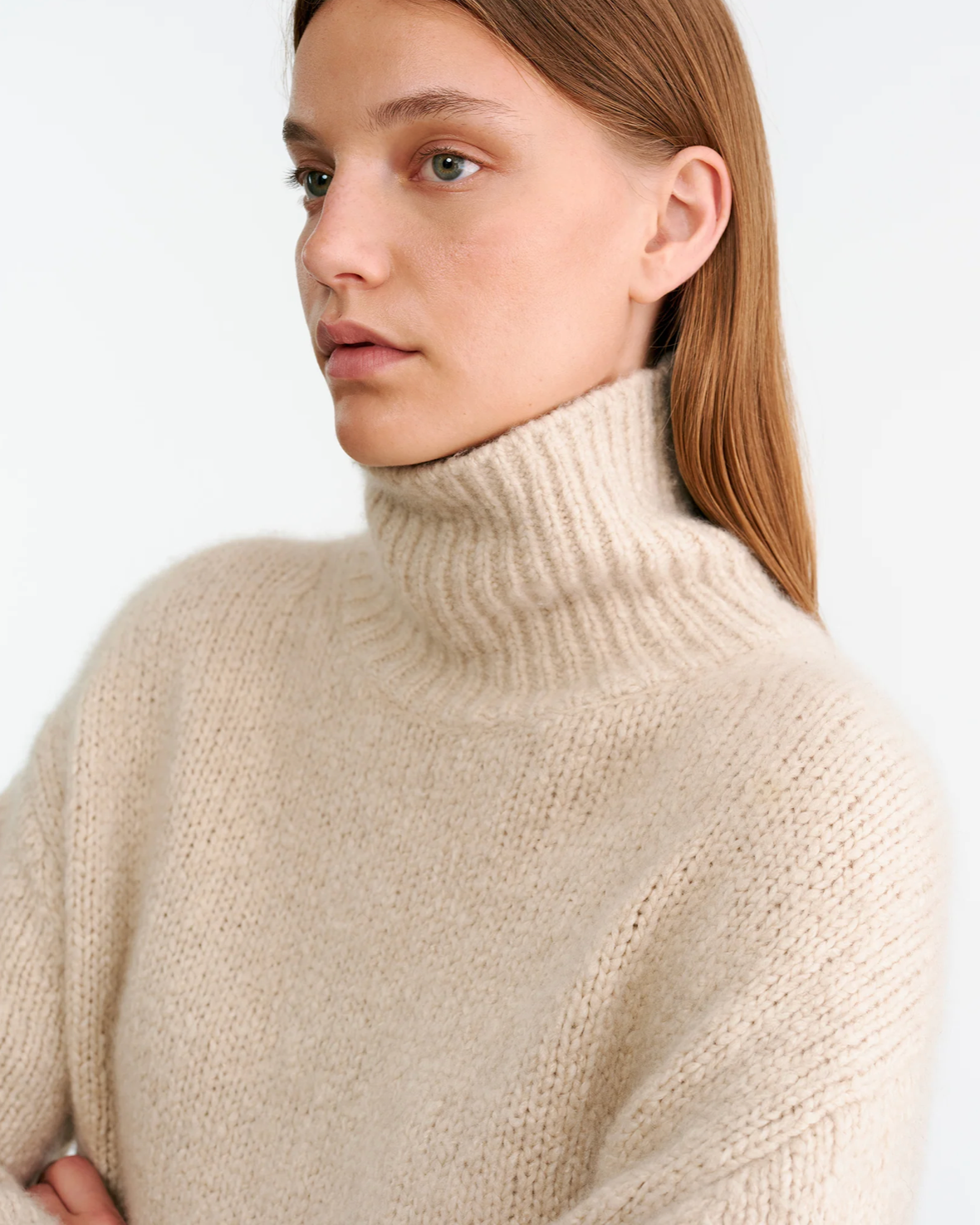 Lifestyle shot of wearing the Tabitha Sweater in Beige Melange, perfect for casual outings.