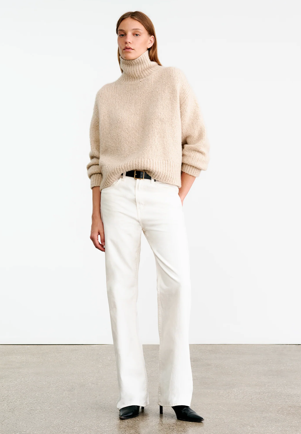 Close-up of Tabitha Sweater in Beige Melange highlighting the ribbed hem and sleeves.