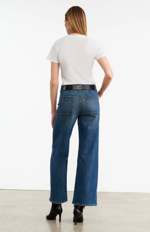 Back view of the Megan Jean in Classic Wash featuring the back patch pockets and darts, designed by Nili Lotan.