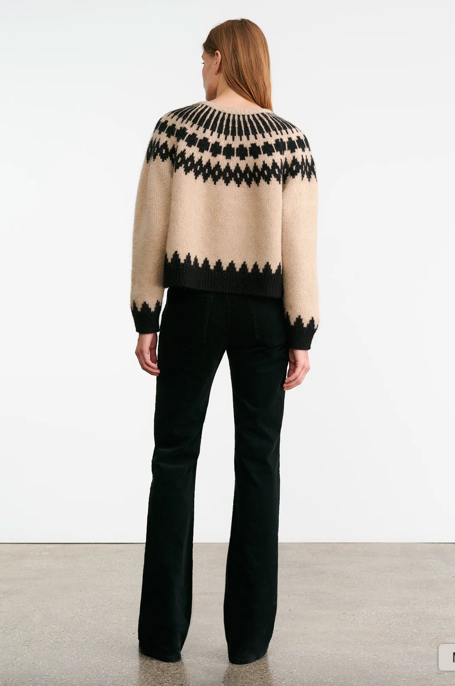 Close-up view of the Alena Sweater in Light Camel Fair Isle with a unique Fair Isle pattern and ribbed details.