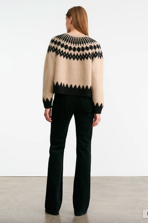 Close-up view of the Alena Sweater in Light Camel Fair Isle with a unique Fair Isle pattern and ribbed details.