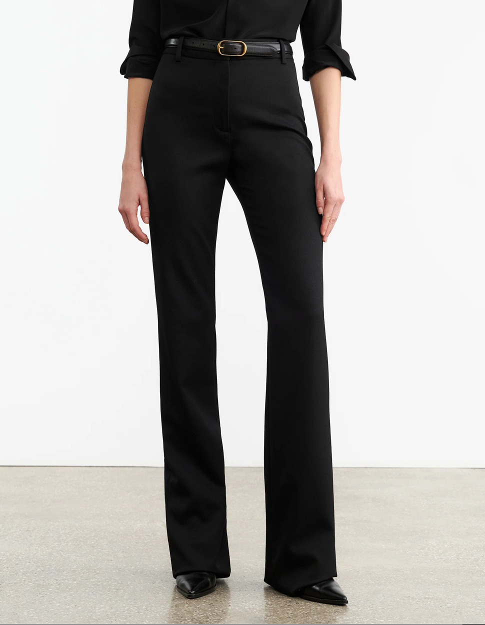 Model wearing Corette Pant in Black, styled with a trendy top showcasing a modern outfit by Nili Lotan.