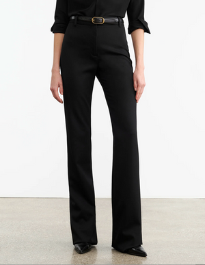 Model wearing Corette Pant in Black, styled with a trendy top showcasing a modern outfit by Nili Lotan.