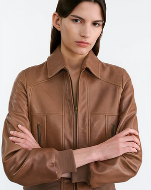 Sue Leather Jacket in Cognac styled with casual attire, perfect for a trendy look.